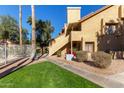 Condo building exterior with walkway and landscaping at 4901 S Calle Los Cerros Dr # 241, Tempe, AZ 85282