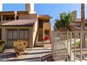 Exterior view of condo building with stairs and gated entry at 4901 S Calle Los Cerros Dr # 241, Tempe, AZ 85282