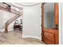 Wood-floored entryway with a staircase and access to other rooms at 4939 W Jomax Rd, Phoenix, AZ 85083