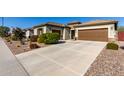 House exterior with a long driveway and desert landscaping at 5640 W Victory Way, Florence, AZ 85132