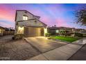 Two-story house with a brown garage door and landscaped yard at 731 E Las Colinas Pl, Chandler, AZ 85249