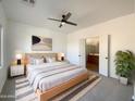 Main bedroom with ensuite bathroom and neutral decor at 10958 E Secret Mine Ct, Gold Canyon, AZ 85118