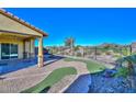 Patio with artificial turf and mountain views at 12128 W Desert Mirage Dr, Peoria, AZ 85383