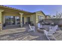 Patio with firepit and seating area at 12128 W Desert Mirage Dr, Peoria, AZ 85383
