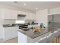 Modern kitchen with stainless steel appliances and granite countertops at 1337 W Inca Dr, Coolidge, AZ 85128