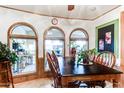 Bright dining area with wood table and chairs, overlooking the patio at 17200 W Bell Rd # 641, Surprise, AZ 85374