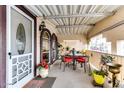 Covered patio with seating area and potted plants at 17200 W Bell Rd # 641, Surprise, AZ 85374