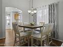 Small dining area with a square table and four chairs at 20948 N Sansom Dr, Maricopa, AZ 85138