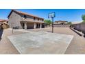 Large backyard with paved patio and basketball court at 225 N 236Th Ave, Buckeye, AZ 85396