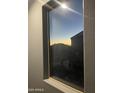 Window view showcasing a colorful sunset over the neighborhood at 30770 W Mitchell Dr, Buckeye, AZ 85396
