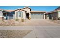 Single-story home with a two-car garage and landscaped front yard at 3392 E Strawberry Dr, Gilbert, AZ 85298
