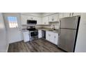 Modern kitchen featuring stainless steel appliances and granite countertops at 5323 N 19Th Ave # 24, Phoenix, AZ 85015