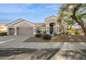Single-story home with a two-car garage and desert landscaping at 5403 E Cannon Dr, Paradise Valley, AZ 85253