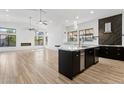 Open kitchen featuring modern island with white marble countertops and stainless steel appliances at 5403 E Cannon Dr, Paradise Valley, AZ 85253