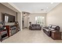 Living room with fireplace and comfortable seating at 9610 E Rocky Lake Dr, Sun Lakes, AZ 85248