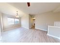 Bright dining room with hardwood floors and chandelier at 1445 E Broadway Rd # 222, Tempe, AZ 85282