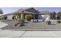 Landscaped front yard with gravel, rocks, and desert plants at 147 S Los Cielos Ln, Casa Grande, AZ 85194