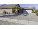 Gravel yard with desert landscaping and walkway at 147 S Los Cielos Ln, Casa Grande, AZ 85194