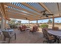 Covered patio with seating area and golf course view at 15220 W Blue Verde Dr, Sun City West, AZ 85375