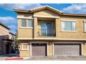 Two-story building with private balconies and attached garages at 15240 N 142Nd Ave # 2159, Surprise, AZ 85379