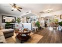 Spacious living room featuring hardwood floors and a modern aesthetic at 15489 N Ridgeview Rd, Sun City, AZ 85351