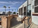 Steps leading to the entrance of a manufactured home with brick accents at 2358 S Pomo Ave, Apache Junction, AZ 85119