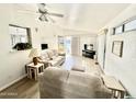 Bright living room with light beige couches and a large TV at 2358 S Pomo Ave, Apache Junction, AZ 85119