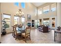 Spacious dining room with large windows and a chandelier at 28990 N White Feather Ln # 130, Scottsdale, AZ 85262