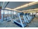 Well-equipped gym with modern treadmills, weights, and floor-to-ceiling windows at 310 S 4Th St # 2202, Phoenix, AZ 85004