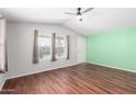 Spacious living room with hardwood floors and accent wall at 3104 E Broadway Rd # 9, Mesa, AZ 85204