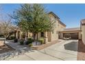 Two-story home boasts a private garage, lengthy driveway and lovely landscaping at 3451 E Tyson St, Gilbert, AZ 85295