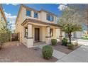 Inviting two-story home with a covered porch, attractive landscaping, and great curb appeal at 3451 E Tyson St, Gilbert, AZ 85295