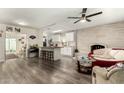 Open living room with kitchen island and fireplace at 4608 N 12Th Pl, Phoenix, AZ 85014