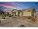 Single story home with front yard landscaping and a two-car garage at 5622 S Tobin Ave, Mesa, AZ 85212