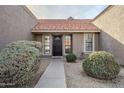 Front entry of a home with a walkway and shrubs at 5821 W Kesler St, Chandler, AZ 85226