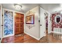 Bright and spacious entryway with hardwood floors and stained glass at 723 S Edgewater Dr, Mesa, AZ 85208