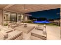 Modern patio furniture near pool and house at 7537 N Lakeside Ln, Paradise Valley, AZ 85253