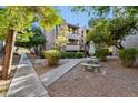 Community courtyard with sitting area and landscaping at 7777 E Main St # 228, Scottsdale, AZ 85251