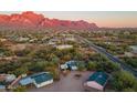 Aerial view showing two houses nestled in a desert landscape with mountain backdrop at 831 N Arroya Rd, Apache Junction, AZ 85119