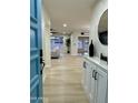 Light and airy entryway, showcasing a view of the living room at 10301 W Cheryl Dr, Sun City, AZ 85351