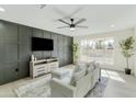 Light-filled living room with modern decor and a large window at 10301 W Cheryl Dr, Sun City, AZ 85351