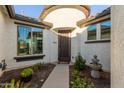 Courtyard entry with a decorative fountain at 10496 W Cottontail Ln, Peoria, AZ 85383