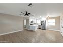 Modern kitchen featuring stainless steel appliances and an island at 11411 E Crescent Ave, Mesa, AZ 85208