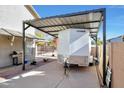 Covered carport with attached storage at 11553 N 76Th Dr, Peoria, AZ 85345