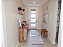 Bright and airy entryway with wood-look flooring and a decorative wall at 12075 E Chevelon Trl, Gold Canyon, AZ 85118