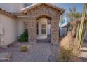 Attractive front entry with stone archway and paved walkway at 1397 E Cheyenne St, Gilbert, AZ 85296