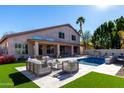 Expansive backyard oasis featuring a sparkling pool and patio furniture at 16614 N 51St St, Scottsdale, AZ 85254