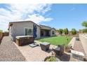 Spacious backyard with a hot tub and putting green at 18370 W Goldenrod St, Goodyear, AZ 85338