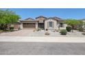 Charming craftsman style home with a landscaped yard at 18370 W Goldenrod St, Goodyear, AZ 85338