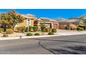 House exterior with a landscaped yard and a two-car garage at 18904 W Mercer Ln, Surprise, AZ 85388